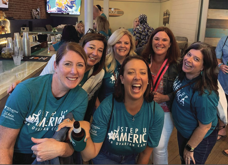 Large group of people enjoying beverages and wearing STAAR's Step Up America for ovarian cancer tshirts and enjoying a fun fundraising event to benefit low grade serous ovarian cancer lgsoc research
